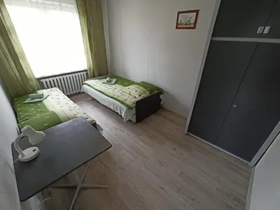 a small room with a bed and a mirror at Apartament-studio, pokoje u Lucy in Rabka