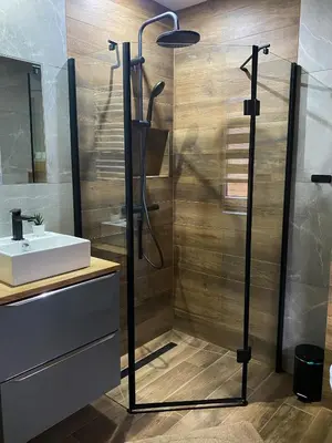 a bathroom with a shower and a sink at Babie Domki in Zawoja