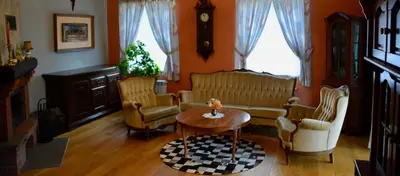 a living room with a couch and chairs and a table at Siedlisko Inwałd in Inwałd