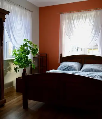 a bedroom with a bed and a window at Siedlisko Inwałd in Inwałd