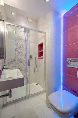 a bathroom with a shower and a toilet and a sink at Libro Rooms in Kraków