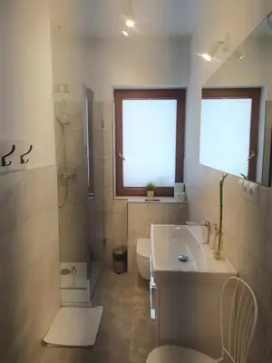 a bedroom with two beds and a glass table at Między Wierchami in Ponice