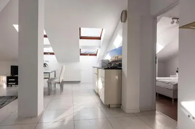 a white room with a bed and a table at MK Apartment 100m2 Friends&Family in Kraków