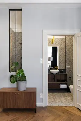 a bathroom with a sink and a mirror at Starowislna 77 in Kraków