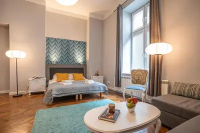 a living room with a bed and a couch at Perfect place to stay in Kraków City Center in Kraków
