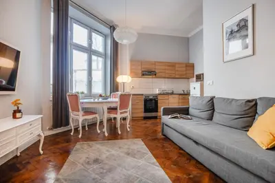 a living room with a couch and a table at Perfect place to stay in Kraków City Center in Kraków