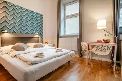 a bedroom with a bed and a table and chairs at Perfect place to stay in Kraków City Center in Kraków