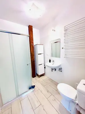 a bathroom with a toilet and a sink at Apartament Salton in Bochnia