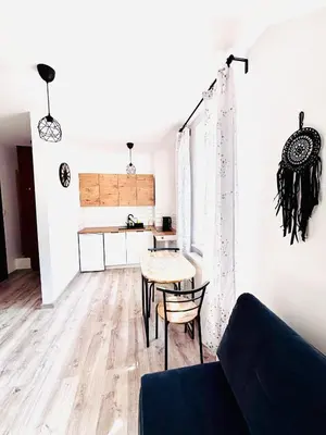 a living room with a couch and a table at Apartament Salton in Bochnia