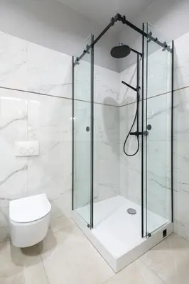 a glass shower in a bathroom with a toilet at LUXURY Apartment at the Main Square in Kraków