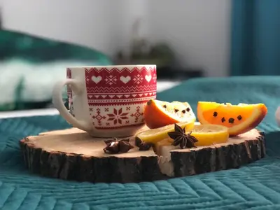 a cup of coffee and some fruit on a table at Hotel Restauracja U Guta in Klikuszowa