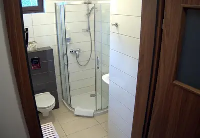 a bathroom with a shower and a toilet at Hotel Kochanów in Kochanów