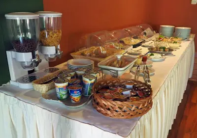 a buffet line with food and drinks on a table at Hotel Kochanów in Kochanów