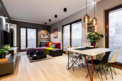a home office with a desk and a tv at Elegant Business Accommodation with Parking - by Upstairs in Kraków