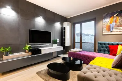 a living room with a table and a couch at Elegant Business Accommodation with Parking - by Upstairs in Kraków