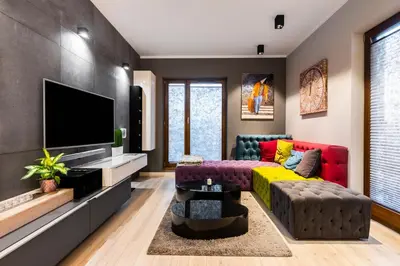 a living room with a couch and a tv at Elegant Business Accommodation with Parking - by Upstairs in Kraków