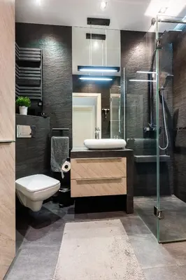 a bathroom with a sink and a toilet and a shower at Elegant Business Accommodation with Parking - by Upstairs in Kraków