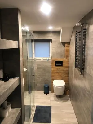 a bathroom with a toilet and a glass shower at FANTAZJA in Spytkowice