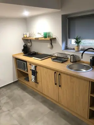 a kitchen with a sink and a counter at FANTAZJA in Spytkowice