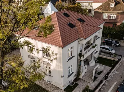 an overhead view of a white house with a red roof at Wesoła by Landmark Apartments in Kraków