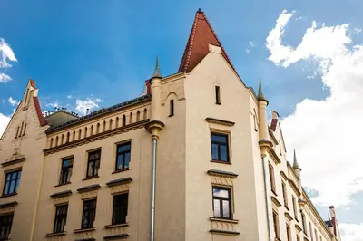 a building with a turret on top of it at Native Apartments Blich 7 in Kraków