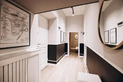 a hallway with a mirror on the wall at Native Apartments Paulińska 20 in Kraków