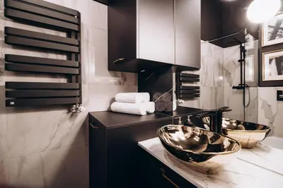 a bathroom with two sinks on a counter at Native Apartments Paulińska 20 in Kraków