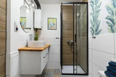 a bathroom with a sink and a shower at SKY Apartment 1 in Oświęcim