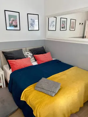 a bedroom with a bed with a suitcase on it at Pokoje w Starej Karczmie - by Upstairs in Liszki