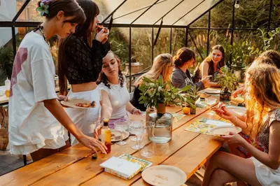 a group of people sitting around a wooden table at Zacisze in Morawica
