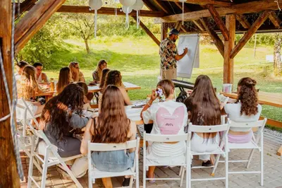 a group of young people sitting in chairs in a seminar at Zacisze in Morawica