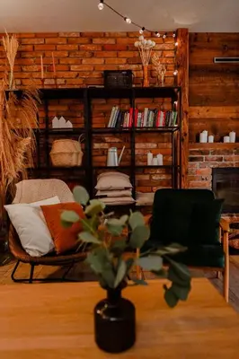 a living room with a couch and a chair at Zacisze in Morawica