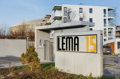 a sign that reads leena in front of a building at Apartments Supernova near Tauron Arena by Noclegi Renters in Kraków