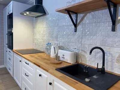 a kitchen with a sink and a counter top at Apartamenty Centrum in Andrychów