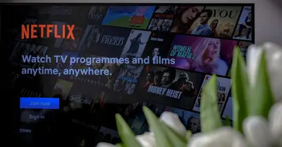 a tv screen with many tv programs and films at Tower Street Apartments in Kraków
