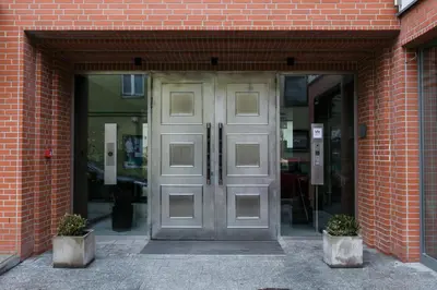 a pair of doors in a brick building at Otium Old Town Harmonica in Kraków