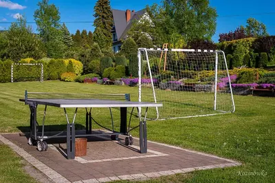 a ping pong table in front of a net at Kozinówka in Zawoja