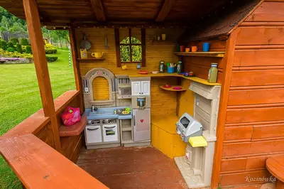 a play house with a kitchen in the middle at Kozinówka in Zawoja