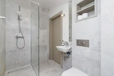 a bathroom with a shower and a sink at Modern Studio Węgierska Cracow by Noclegi Renters in Kraków