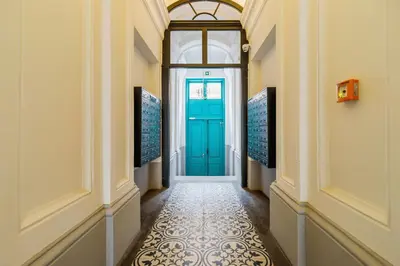 a hallway with a blue door in a building at Modern Studio Węgierska Cracow by Noclegi Renters in Kraków
