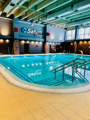 a large swimming pool in a large building at Garden Corner in Kraków