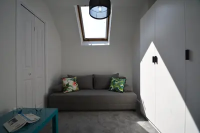 a living room with a couch and a table at Willa Wiesia Rabka Zdrój in Rabka