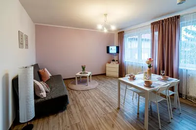 a living room with a couch and a table at Kopalnia Snów in Wieliczka