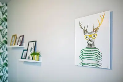 a living room with a green couch and a table at Apartament with Garden BEZPŁATNY PARKING !!! in Kraków