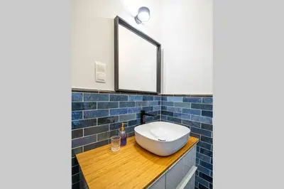 a white kitchen with white cabinets and appliances at Apartament with Garden BEZPŁATNY PARKING !!! in Kraków