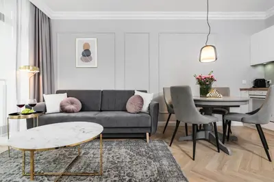 a living room with a couch and a table at Wielopole17 Miro Apartment with AC in Kraków