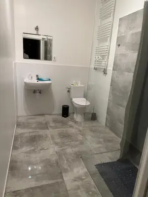 a bathroom with a toilet and a sink at Cracow bb in Kraków