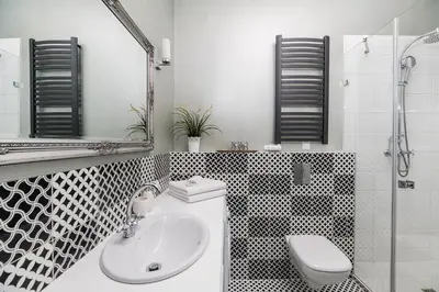 a bathroom with a sink and a toilet and a mirror at Native Apartments Batorego 7- Bardzo ciche i spokojne miejsce in Kraków