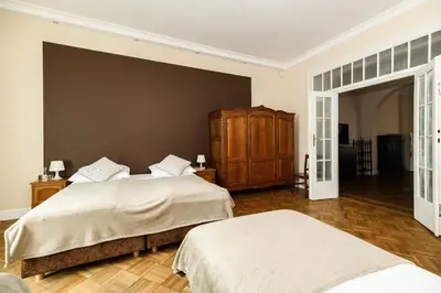 a bedroom with two beds and a wall at Native Apartments Batorego 7- Bardzo ciche i spokojne miejsce in Kraków