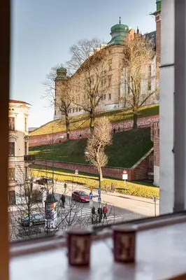 a view of a building from a window at Vintage Podzamcze Apartment in Kraków